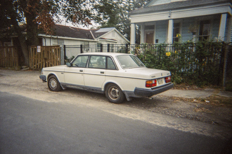Car parked beside homes near St. Charles Avenue in New Orleans